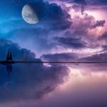 A mystical new moon in the night sky, surrounded by glowing energy, symbolizing new beginnings and intention setting.